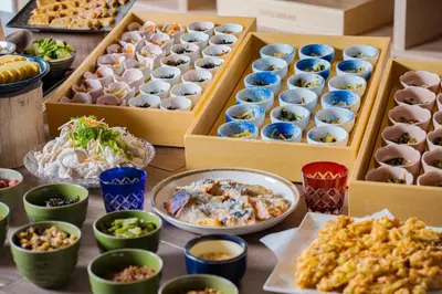 a table topped with boxes filled with different types of food at Premier Hotel Cabin Shinjuku in Tokyo