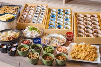 a table topped with boxes of different types of food at Premier Hotel Cabin Shinjuku in Tokyo