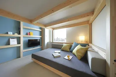 a small room with a bed and a large window at OMO5 Tokyo Otsuka by Hoshino Resorts in Tokyo