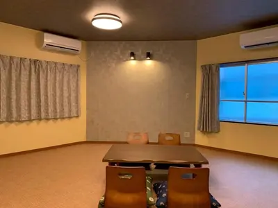 a room with a table and chairs and a large window at HOTEL PRELE Asakusa \u30db\u30c6\u30eb\u30d7\u30ec\u30fc\u30eb\u6d45\u8349 in Tokyo