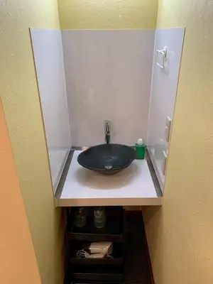 a sink in a bathroom with a mirror at HOTEL PRELE Asakusa \u30db\u30c6\u30eb\u30d7\u30ec\u30fc\u30eb\u6d45\u8349 in Tokyo
