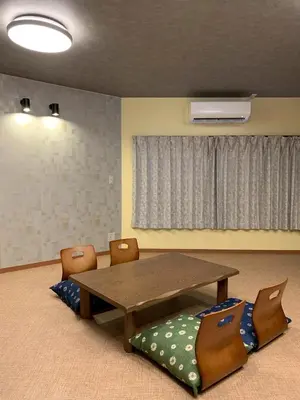 a dining room with a wooden table and chairs at HOTEL PRELE Asakusa \u30db\u30c6\u30eb\u30d7\u30ec\u30fc\u30eb\u6d45\u8349 in Tokyo