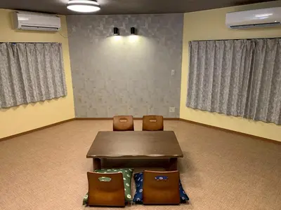 a room with a table and two chairs in it at HOTEL PRELE Asakusa \u30db\u30c6\u30eb\u30d7\u30ec\u30fc\u30eb\u6d45\u8349 in Tokyo