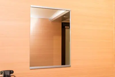 a mirror hanging on a wooden door at Ryoma Ikebukuro in Tokyo