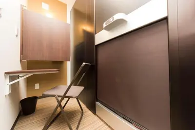 a chair in a room with a sliding door at Ryoma Ikebukuro in Tokyo