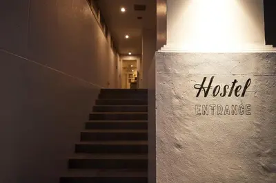 a staircase in a building with a sign that reads motel entrance at Turn Table in Tokyo