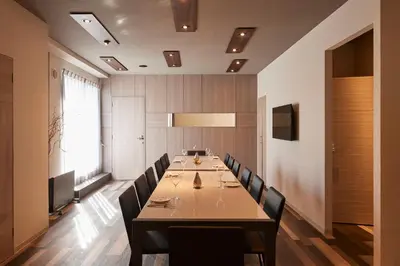 a large dining room with a long table and chairs at Turn Table in Tokyo