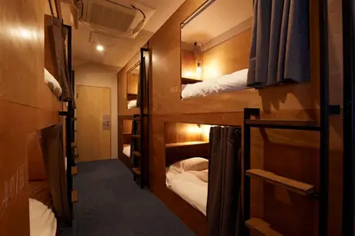 a group of bunk beds in a room at Turn Table in Tokyo