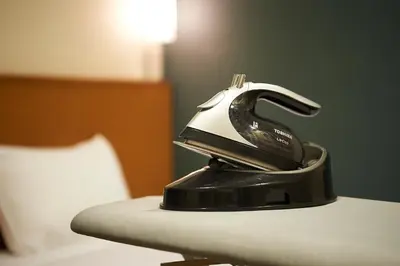 a iron sitting on top of a table at Sotetsu Fresa Inn Tokyo Kanda in Tokyo