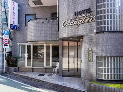 a building with a sign that reads hotel changed at Chang Tee Hotel Ikebukuro in Tokyo
