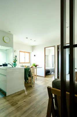 a kitchen and a living room with a table at Home n Lounge in Tokyo