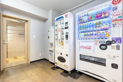 a couple of soda machines in a room at HOTEL MYSTAYS Nippori in Tokyo
