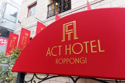 a red sign for aat hotel rooftop at Act Hotel Roppongi in Tokyo
