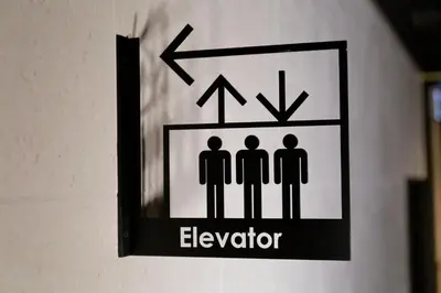 a sign on a wall that says elevator at Act Hotel Roppongi in Tokyo