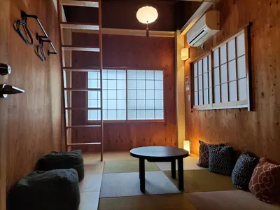 a living room with a table and a window at Vacation
