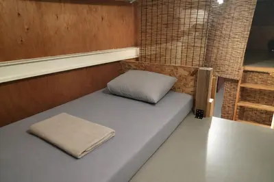 a bed in the back of a boat with a pillow at Vacation