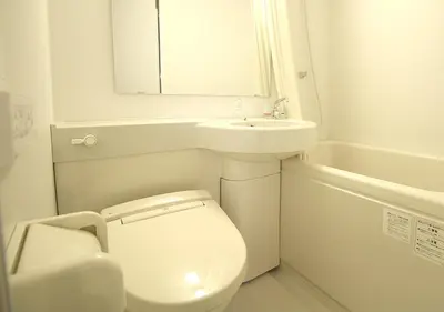 a white bathroom with a toilet and a sink at Hotel Trend Asakusa Annex in Tokyo
