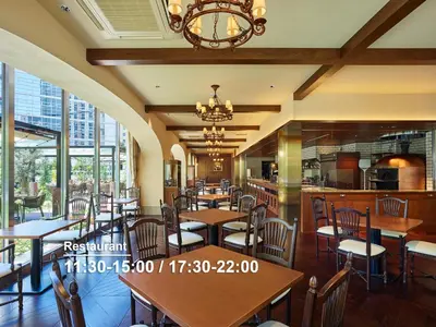 a restaurant with wooden tables and chairs and windows at Mitsui Garden Hotel Gotanda - Tokyo in Tokyo
