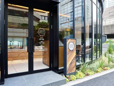 a entrance to a building with a sign in the window at Mitsui Garden Hotel Otemachi - Tokyo in Tokyo
