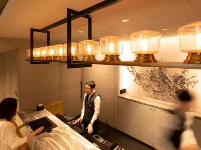 a group of people in a room with lights at Mitsui Garden Hotel Otemachi - Tokyo in Tokyo