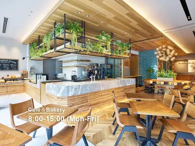 a restaurant with wooden tables and chairs and plants at Mitsui Garden Hotel Otemachi - Tokyo in Tokyo