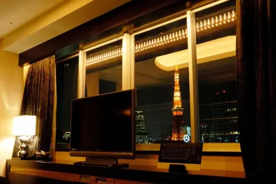 a window with a view of the eiffel tower at HOTEL THE GLANZ in Tokyo