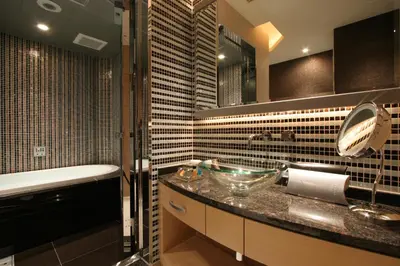 a bathroom with a sink and a bath tub at HOTEL THE GLANZ in Tokyo