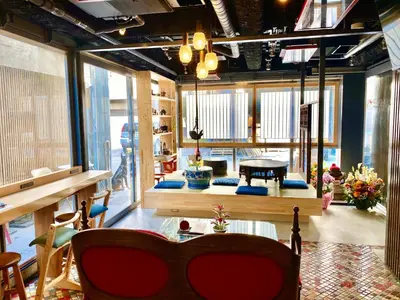a living room with a piano in the middle at Andon Ryokan in Tokyo