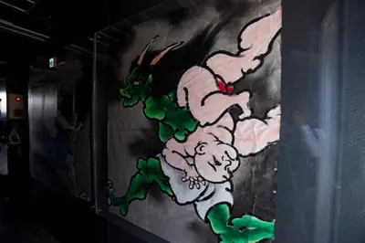 a painting of a dragon on a wall at Andon Ryokan in Tokyo