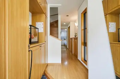 a hallway of a house with wooden cabinets at F1-Upmarket Huose in Shinjuku in Tokyo