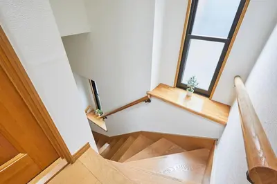 a staircase in a house with a window at F1-Upmarket Huose in Shinjuku in Tokyo