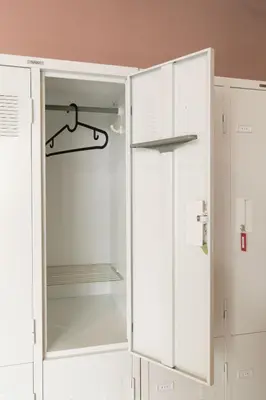 a white refrigerator with its door open in a kitchen at hostel DEN in Tokyo