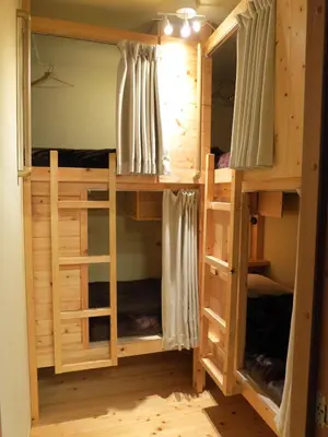 a room with a bunk bed in a room at No Borders Hostel in Tokyo