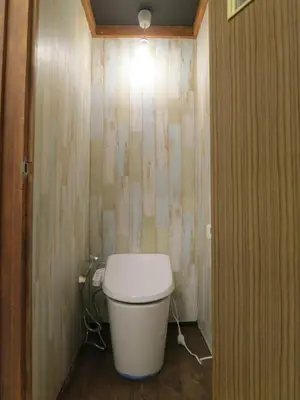 a small bathroom with a toilet in a room at No Borders Hostel in Tokyo