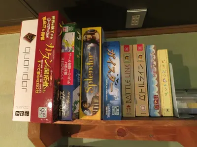 a bunch of books sitting on a shelf at No Borders Hostel in Tokyo