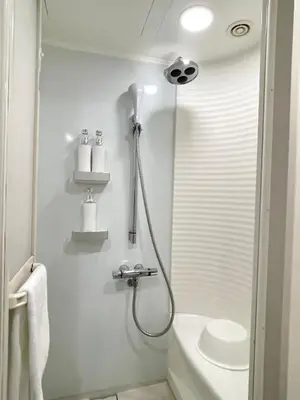 a bathroom with a shower and a sink at Tokyu Stay Kamata - Tokyo Haneda in Tokyo