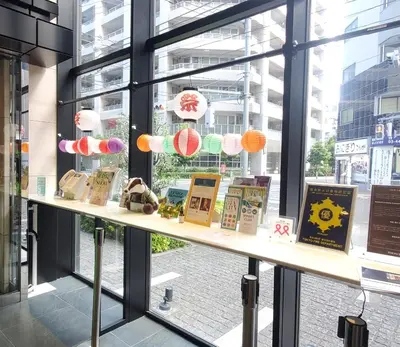 a window display of books on a shelf in a store at Tokyu Stay Kamata - Tokyo Haneda in Tokyo