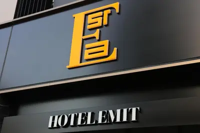 a sign for a hotel exit at Hotel Emit Ueno in Tokyo