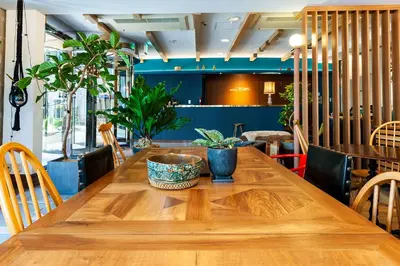 a wooden table with plants on top of it at Hotel Toms in Tokyo