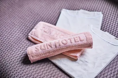 a pair of towels and a brush on a table at Urayasu Sun Hotel in Urayasu