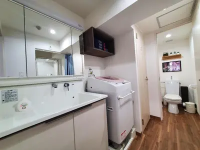 a small bathroom with a sink and a toilet at Rooms in Tokyo
