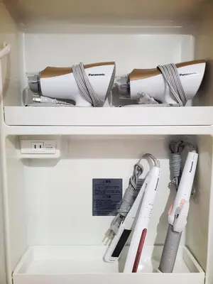 a refrigerator filled with lots of kitchen utensils at Rooms in Tokyo