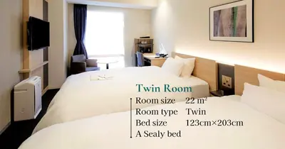 a hotel room with two beds and a tv at Tmark City Hotel Tokyo Omori in Tokyo