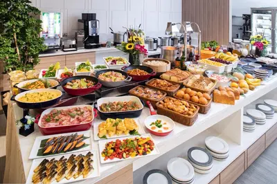a buffet with many different types of food on a table at Tmark City Hotel Tokyo Omori in Tokyo