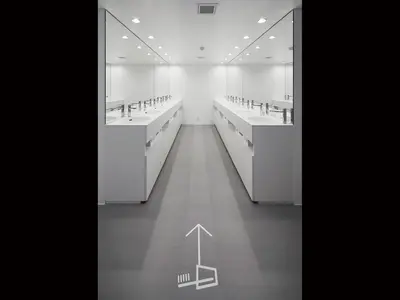 a black and white photo of a bathroom with sinks and mirrors at 9h nine hours Akasaka in Tokyo