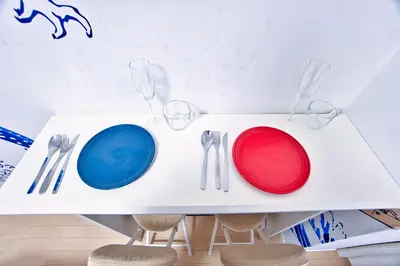 a white table with plates and utensils on it at Square Shibuya 407 in Tokyo