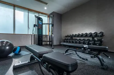 a gym with a bunch of exercise bikes in it at ART HOTEL Nippori Lungwood in Tokyo