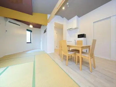 a dining room with a table and chairs at COTO Tokyo Asakusa 4 in Tokyo