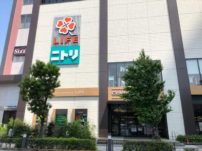a building with a sign on the side of it at COTO Tokyo Asakusa 4 in Tokyo