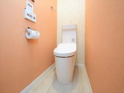 a bathroom with a toilet and a roll of toilet paper at COTO Tokyo Asakusa 4 in Tokyo
